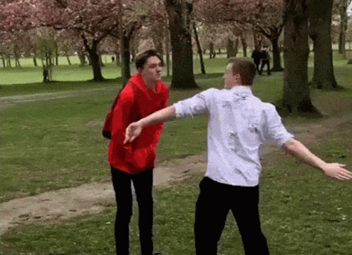 funny gif of a skinny white dude willingly getting slapped in the face such that he falls over.