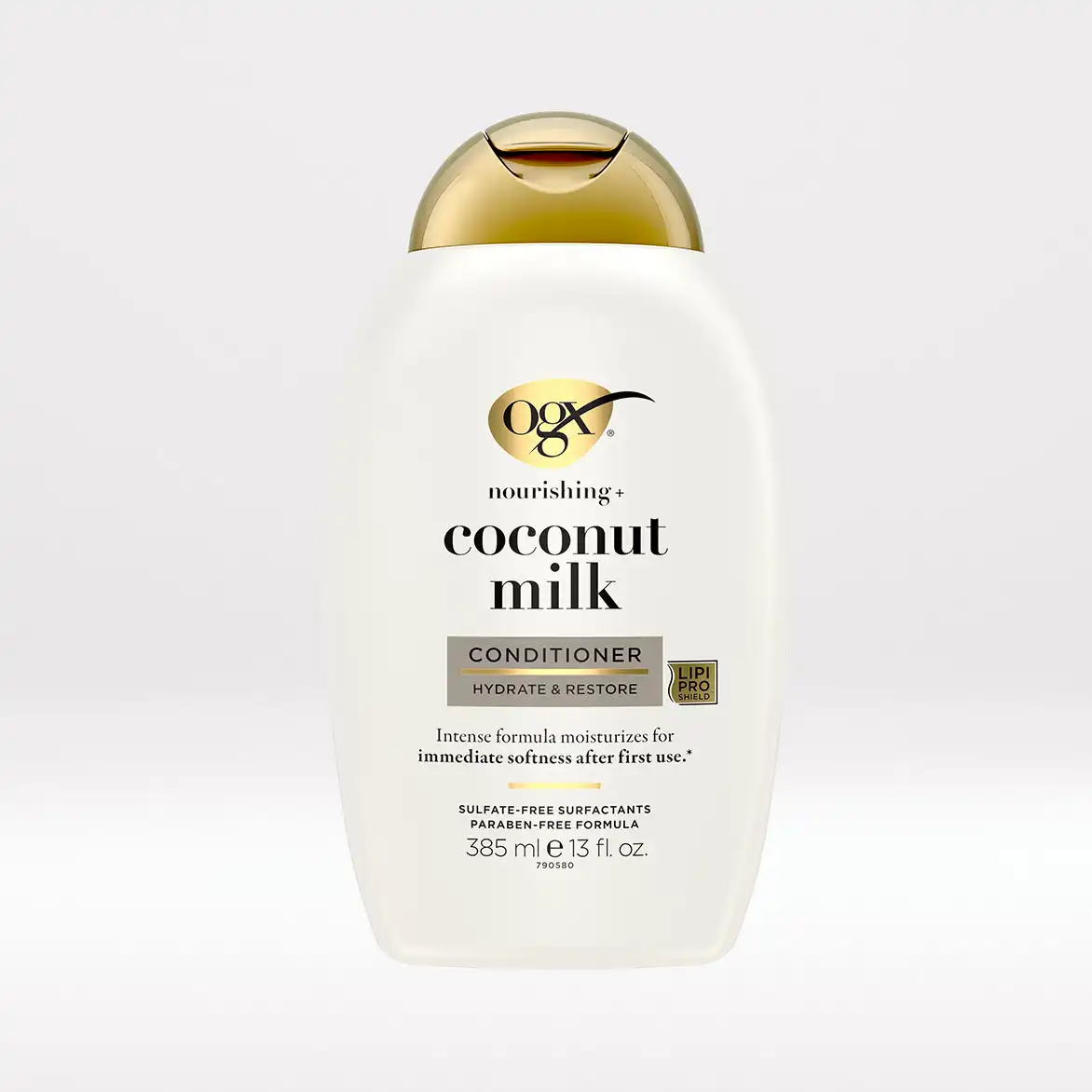 A bottle of ogx nourishing coconut milk hair conditioner. "Intense formula moisturizes for immediate softness after first use."
